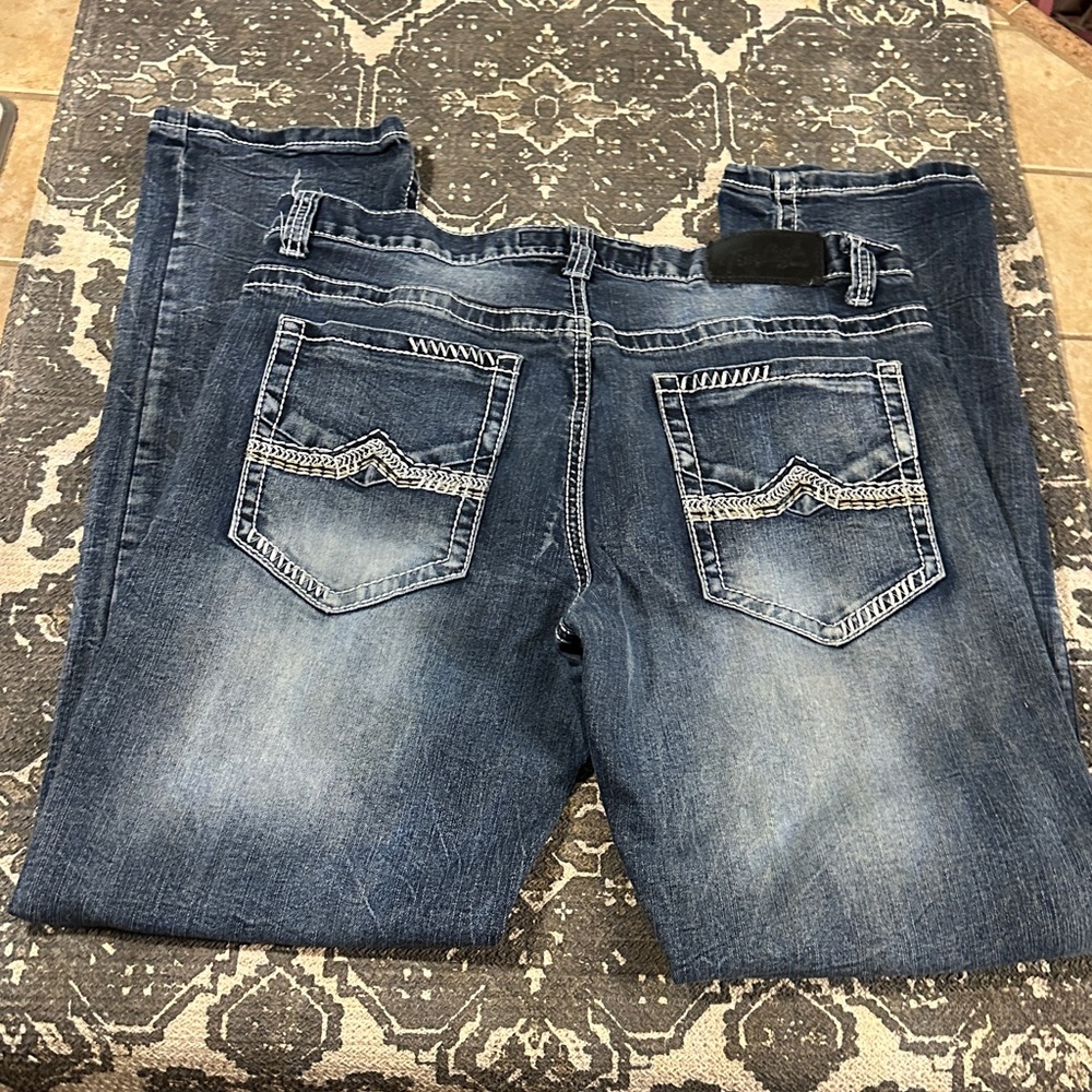 Blue Jeans With Black Leather Patch - image 4